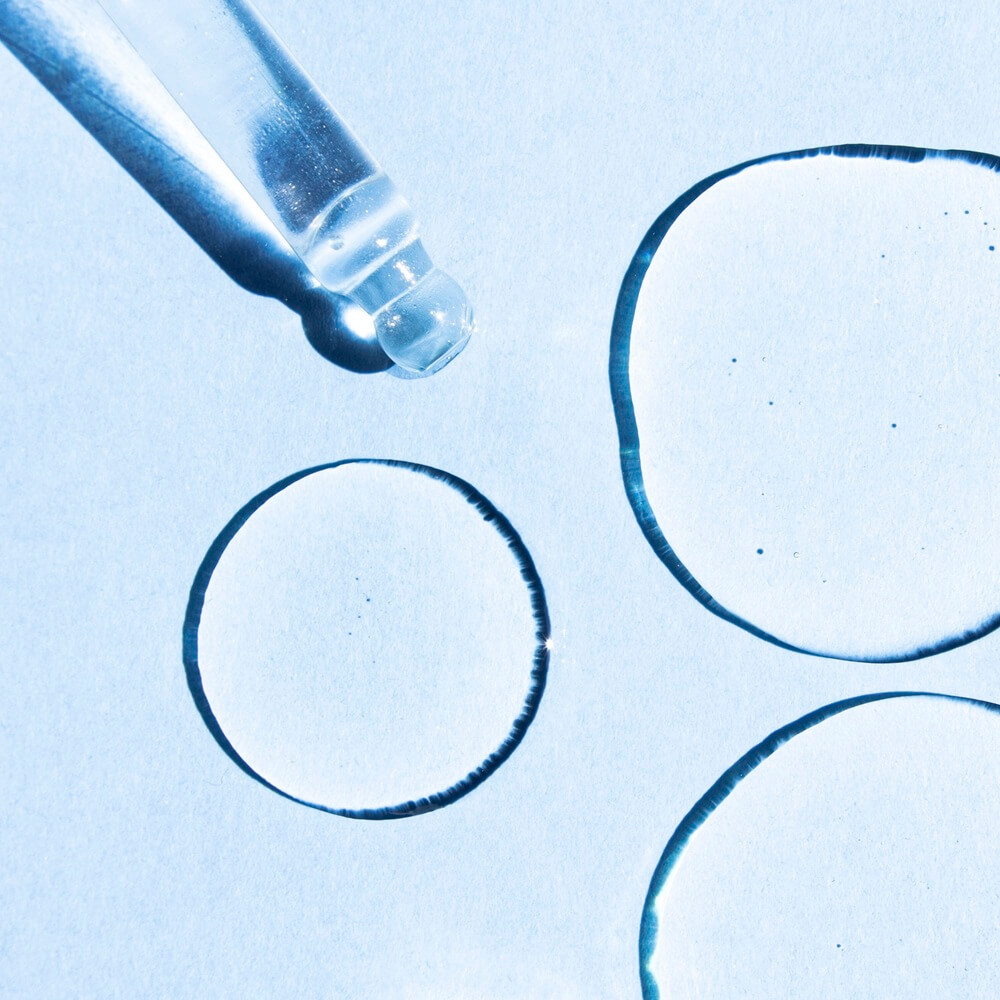 close-up-of-drops-of-transparent-cosmetic-hyaluronic-acid